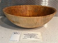 Front profile of full wood bowl showing exterior shape with MaxSold tag and Woodlot Harvest card