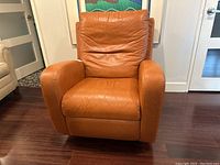Front view of tan leather recliner