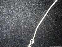 Close-up of clasp and chain texture showing the 925 stamps stamped on the clasp, confirming sterling silver material.