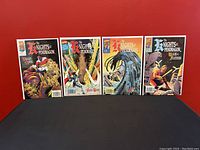 Four Marvel comic books titled The Knights of the Pendragon #1-4, standing against a red background, all bagged and boarded, showing front covers.