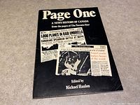 Front cover of the soft cover book showing the title Page One and several historical headlines from The Toronto Star