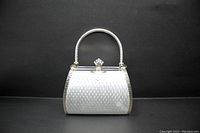 Front view showing silver textured pattern and metal handle