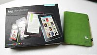 Photo showing the Kobo Vox eReader original box and green protective case