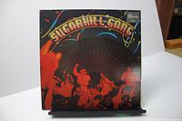 Front cover of The Sugarhill Gang vinyl record album with crowd and stage image, colorful artwork and logo