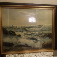 Front view of the framed ocean print showing the artwork and frame.