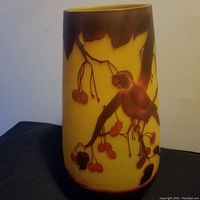 Front view of large Galle style cameo glass vase showing bird on cherry branch design