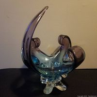 Front view of Mid-Century Modern chalet glass basket showing teal and purple coloration and starburst base.