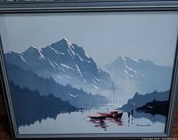 Photo of original oil painting showing mountain scenery with boats and birds on water, signed Raymond.