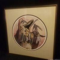 Framed square print with circular raven artwork in earth tones visible, matting and frame included.