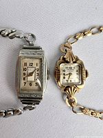Top close-up of both vintage Art Deco wind-up watches showing the Windsor and Medana dials clearly.