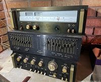 Front view of all three Audio Reflex components stacked, showing tuner on top, equalizer middle, and amplifier bottom.