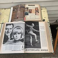 Two open hardbound tomes showing magazine pages including vintage advertisements and editorial content from McLean's 1980 and Life Magazine 1965.