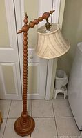 Full view of the lamp showing the maple bobbin turned post and arm with fabric lampshade.