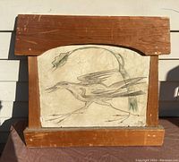 Front view of signed 1957 painting by Mexican artist showing Road Runner bird in stylized depiction with wooden frame.