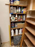 Full view of shelving with various household maintenance products arranged