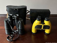 Both binoculars with carrying cases shown; left Soviet with black leather case, right yellow Aquafloat 7x42.