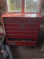 Front view of red Mastercraft tool cabinet showing six drawers