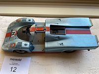 Top view of the vintage Schuco toy Porsche showing racing stripes, Gulf logos, and number 8 decal.