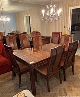 Overview of dining table fully assembled with all eight chairs