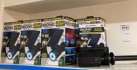 Set of 8 Bell+Howell Bionic solar powered spotlights, seven in box, one unpackaged, displayed on shelf