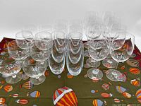 Full view of all 24 glasses arranged in 3 rows showing variety and quantity