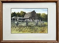 Full view of framed watercolour painting including mat and wood frame showing barn and fence scene