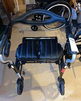 Top-down view of the walker showing padded seat and black frame