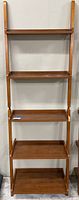 Full view of the assembled leaning ladder shelf unit showing all five shelves, wood tone, and build.