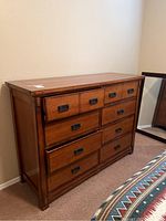 Full view of the Aspen Home dresser showing wood finish, drawer layout, and metal handles.