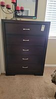 Full front view of the dresser showing five drawers and metal handles.