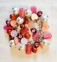 Top view of the assembled bracelet coiled showing the variety of bead types and colors.