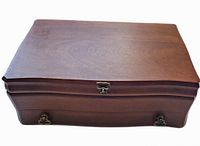 Closed wooden jewelry box with smooth finish and decorative shape