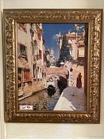 Front view of the framed Brushstrokes textured artwork showing a European canal scene with gondolas, buildings, and a stone arch bridge.