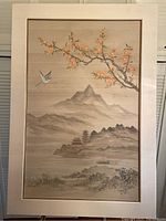 Front view of one silk Chinese painting showing mountainous landscape with blossoms and a bird in flight, framed with minor bubbling issues.