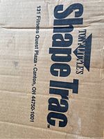 Box with Tony Little Shape Trac branding and address printed on the side.