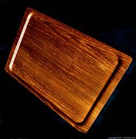 Top angled view of the large rectangular teak tray showing wood grain and finish.