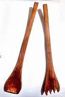 Photo of two wooden salad servers, one spoon and one fork, showing length and overall shape.