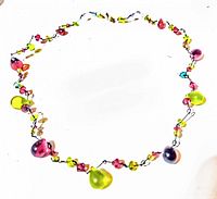 Full view of the vintage glass bead necklace showing colorful beads strung on wire.