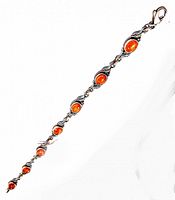 Full length view of the vintage sterling silver bracelet with eight oval amber stones and lobster clasp.