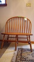 Front view of Windsor style bench showing arrow-back spindles and turned legs