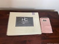 Queen size Hotel Collection sheet set packaged with clear label showing 460 thread count and queen size indication, color is a neutral cream/off-white.