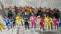Full view showing all 20 action figures including 10 Power Rangers and 10 wrestling figures laid out in two rows.