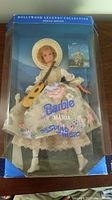 Barbie doll in original box with blue background and identification showing Hollywood Legends Collection Special Edition label.
