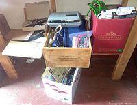 Four boxes with assorted hand tools and hardware including a wooden box and boxes labeled Donovan-Parke and others.