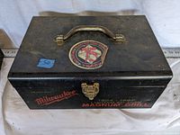 Top view of Milwaukee Magnum Drill metal carrying case with 75th Anniversary Texas Electric Tool Co. emblem and handle.