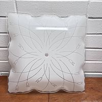 Vintage 1960s glass light shade front view showing scalloped edges and etched floral design