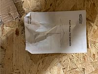 Packaging insert showing product name and line drawing of umbrella with push button tilt.