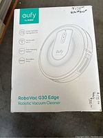 Box front showing product branding, model RoboVac G30 Edge, and key features: smart dynamic navigation 2.0, Wi-Fi compatibility, path tracking sensor, boundary strip.