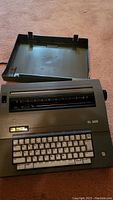 Top view of Smith Corona SL 500 electric typewriter showing keyboard, paper guide, and Smith Corona branding.