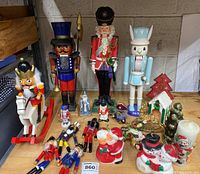 Front view of entire group shows all nutcrackers and candles organized closely on table.